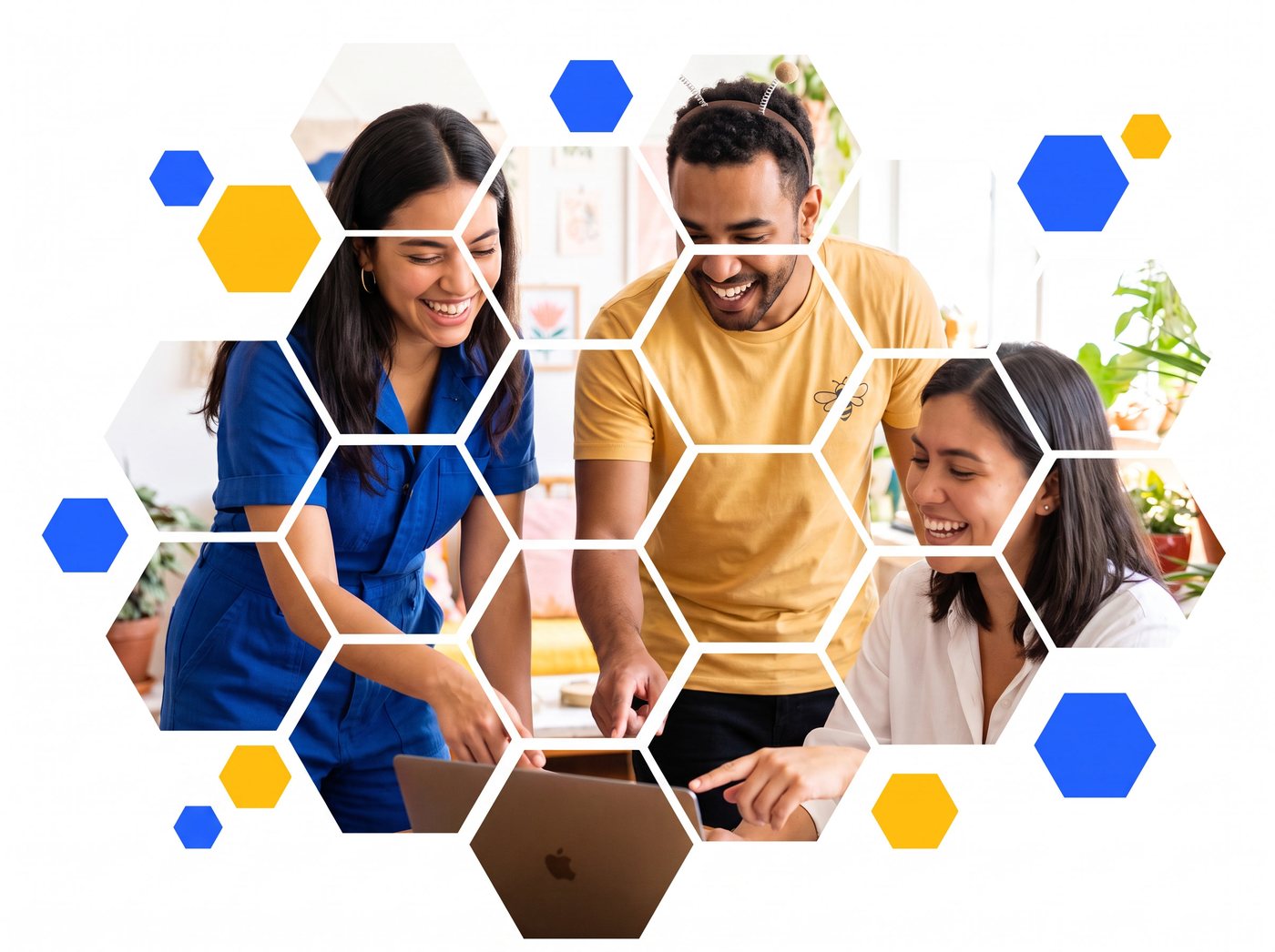 Three teammates smiling around a laptop, framed by blue and gold honeycomb shapes